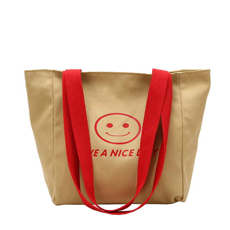 လက်ကား Smiley Face Tote Bag ကြီးမားသောစွမ်းရည်အိတ် အမျိုးသမီးများ 2023 စွယ်စုံရပခုံးအိတ် ကျောင်းသား ကျူတိုရီရယ်အိတ်အသစ် 