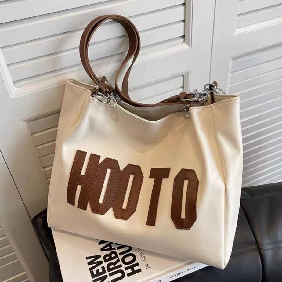 Summer large-capacity fashion texture one-shoulder armpit bag female 2023 new trendy student class commuting tote bag 