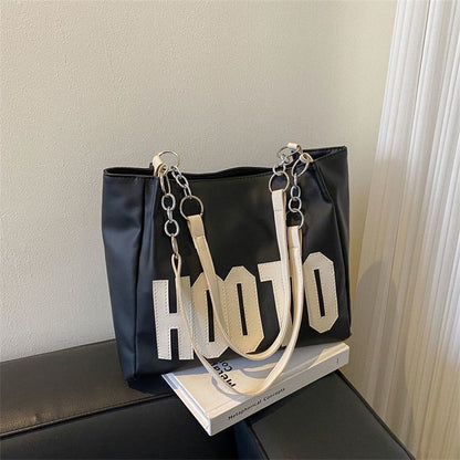 Summer large-capacity fashion texture one-shoulder armpit bag female 2023 new trendy student class commuting tote bag 