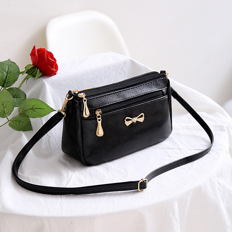 The new mother's trendy handbags pure color pu ladies diagonal shoulder bag bowknot soft leather small bag stall wholesale