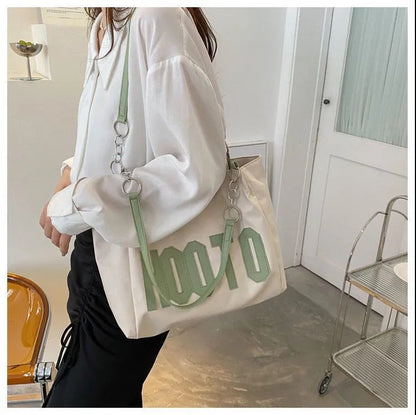 Summer large-capacity fashion texture one-shoulder armpit bag female 2023 new trendy student class commuting tote bag 