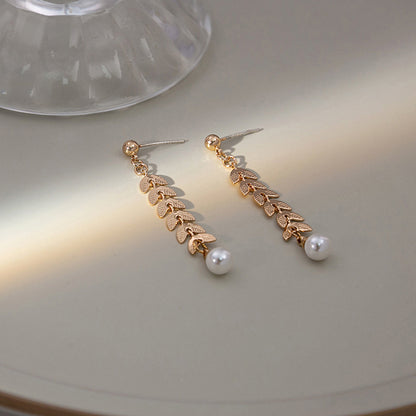 Japanese and Korean diamond-encrusted geometric earrings niche light luxury high-end pearl oil dripping bow earrings wholesale 