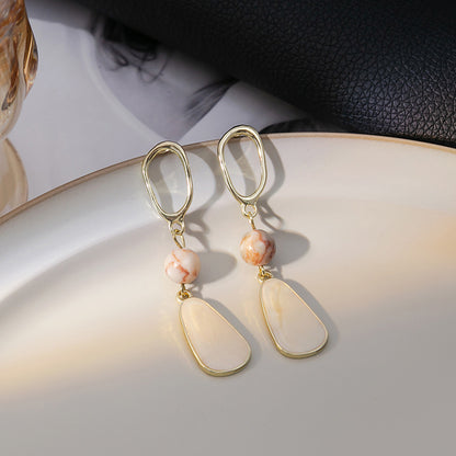 Japanese and Korean diamond-encrusted geometric earrings niche light luxury high-end pearl oil dripping bow earrings wholesale 