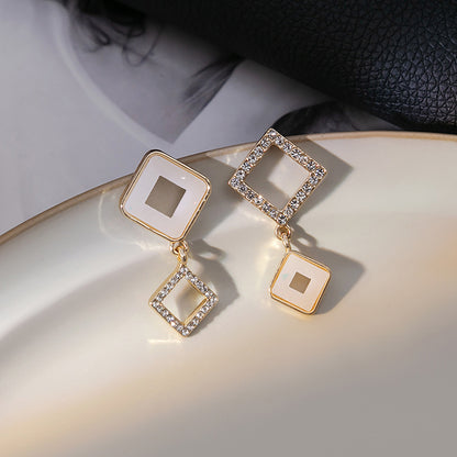 Japanese and Korean diamond-encrusted geometric earrings niche light luxury high-end pearl oil dripping bow earrings wholesale 