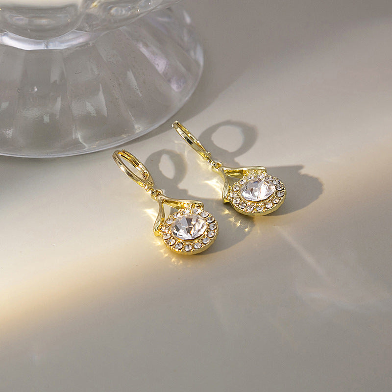 Japanese and Korean diamond-encrusted geometric earrings niche light luxury high-end pearl oil dripping bow earrings wholesale 