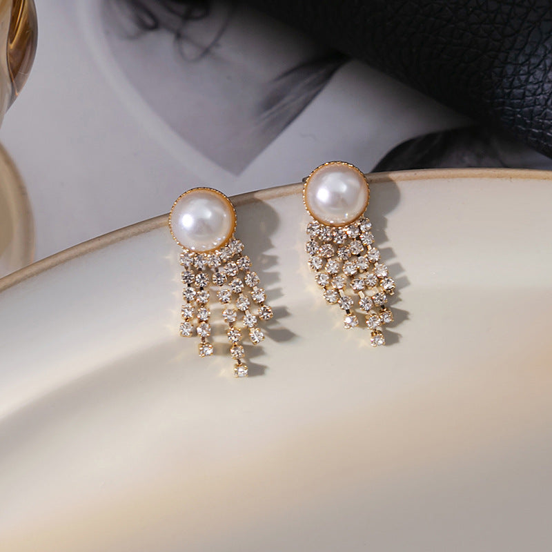 Japanese and Korean diamond-encrusted geometric earrings niche light luxury high-end pearl oil dripping bow earrings wholesale 