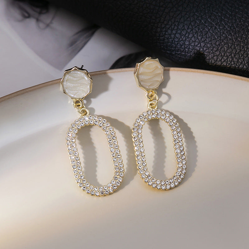 Japanese and Korean diamond-encrusted geometric earrings niche light luxury high-end pearl oil dripping bow earrings wholesale 