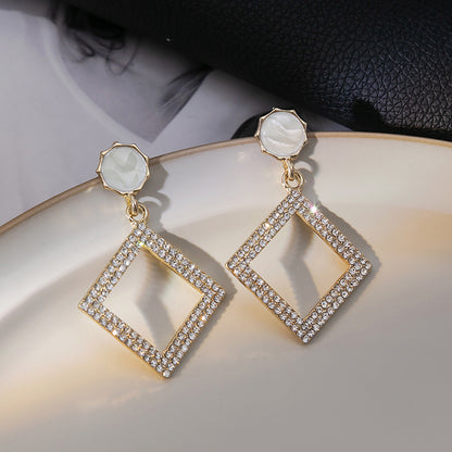 Japanese and Korean diamond-encrusted geometric earrings niche light luxury high-end pearl oil dripping bow earrings wholesale 